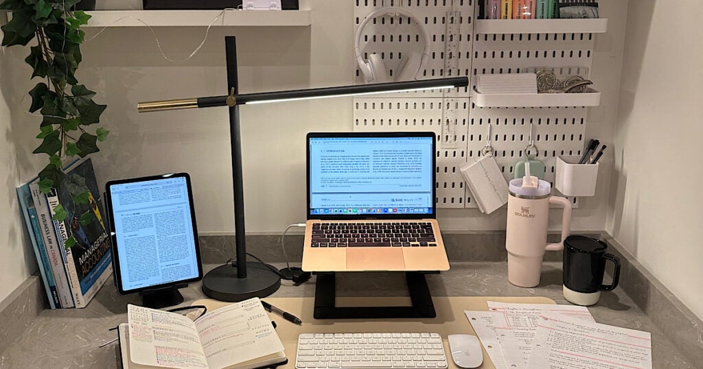 A study desk with an open laptop.