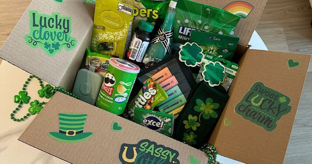 A St Patricks Day college care package open on a table.