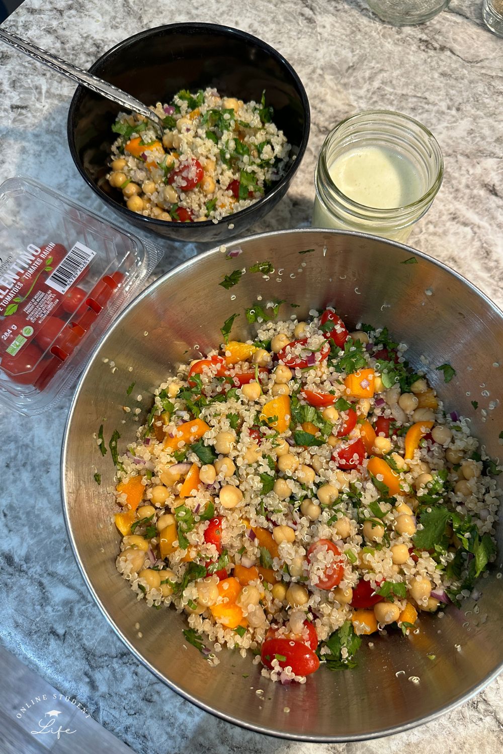 A big bowl of brightly colored quinoa salad meal prep.